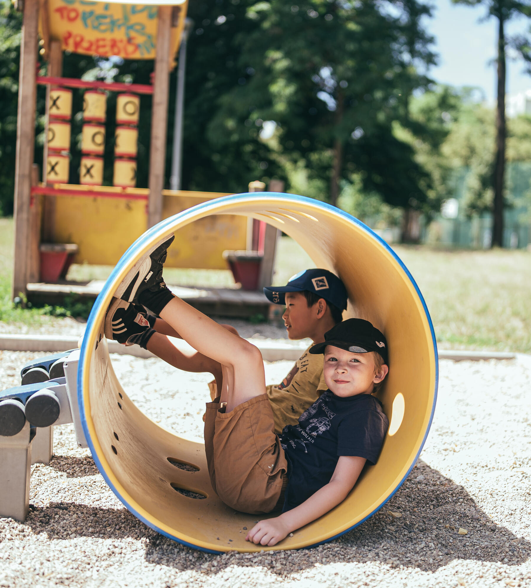 playmakers playing in a nearby playground tube